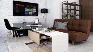 Ruang tamu gaya Japandi dengan sofa minimalis dengan tembok warna abu